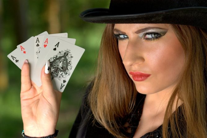 woman holding cards